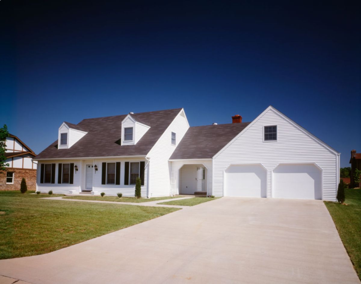 A white home with two large garage doors.