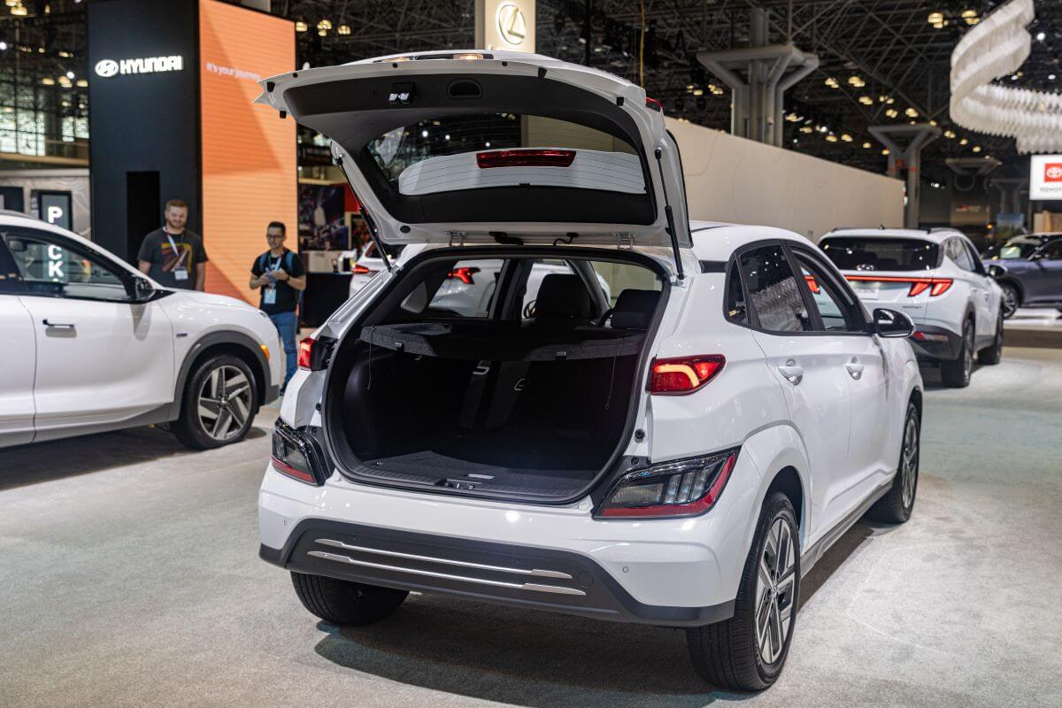 A Hyundai Kona Electric SUV model with an opened liftgate at the 2022 New York International Auto Show (NYIAS)