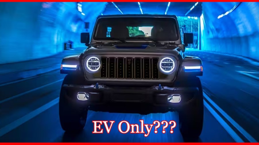 A brown Jeep Wrangler 4xe plug-in hybrid in a tunnel.