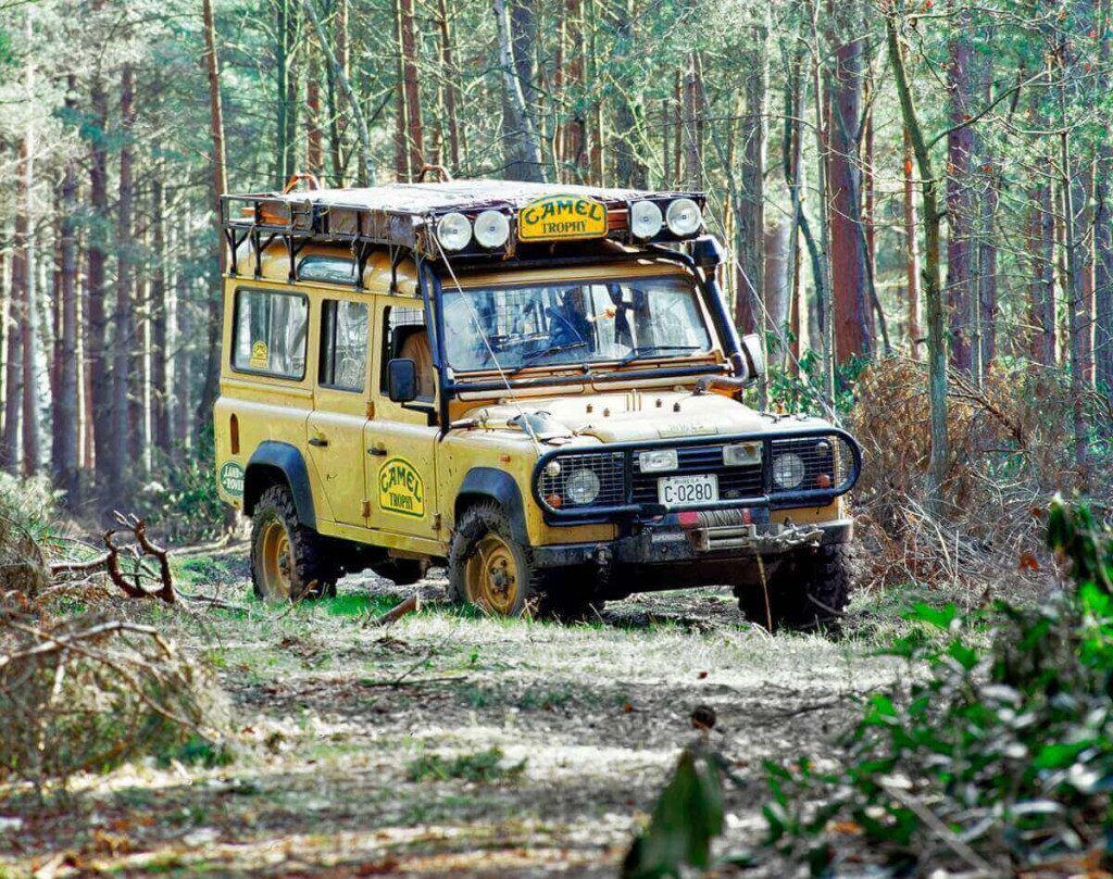 A Defender cruises through a jungle in the Camel Trophy.