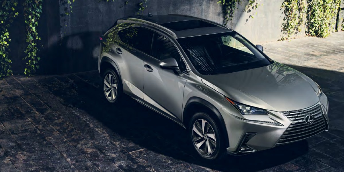 A gray Lexus NX small luxury SUV is parked.