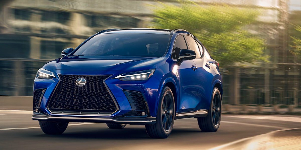A blue Lexus NX small luxury SUV is driving on the road.