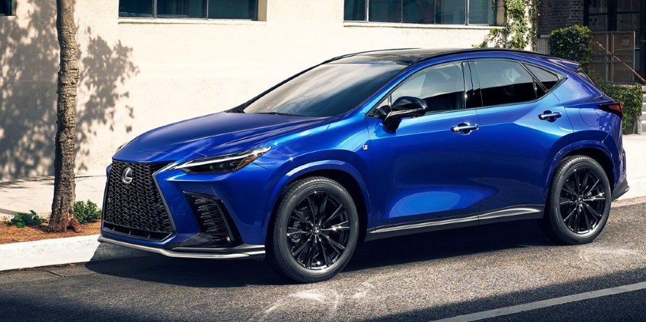A blue Lexus NX small luxury SUV is parked on the road. 