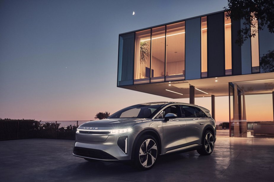 The Lucid Gravity SUV in front of a modern house
