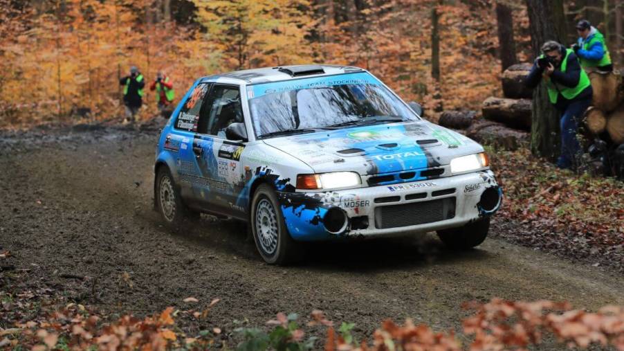 A mud-caked Mazda 323 GT-T or GTX rally car during the Waldviertal Rallye in Horn, Austria