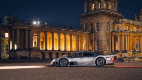 Mercedes-Benz CLK GTR Coupe parked in front of a castle.