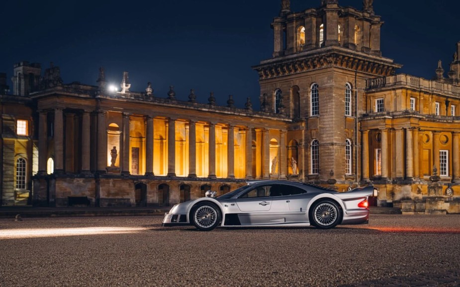 Mercedes-Benz CLK GTR Coupe parked in front of a castle.
