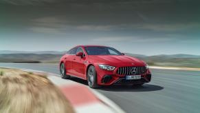 A Mercedes-AMG GT 63 S E Performance grant tourer coupe speeding on a country race track