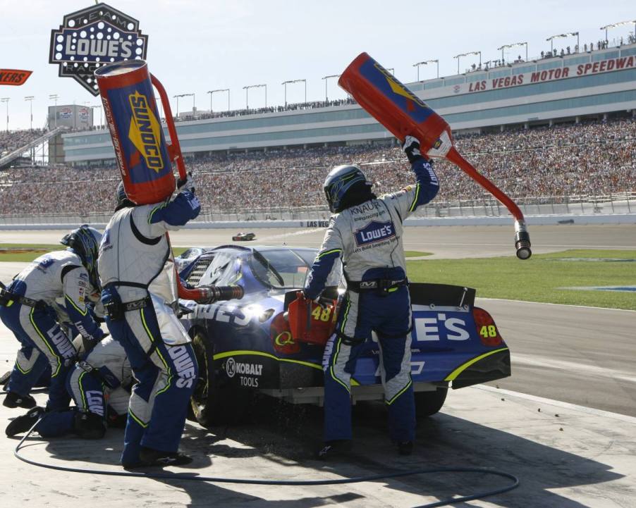 A car stoping for fuel during a NASCAR race.