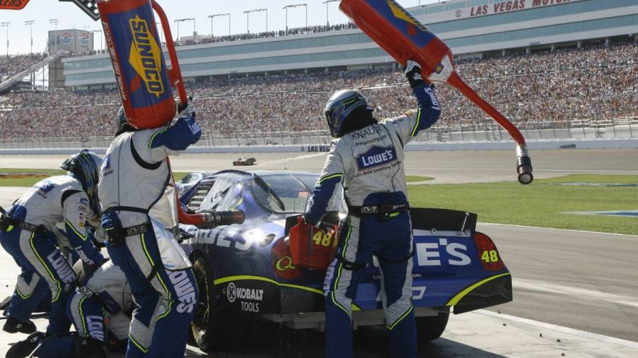 A car stoping for fuel during a NASCAR race.