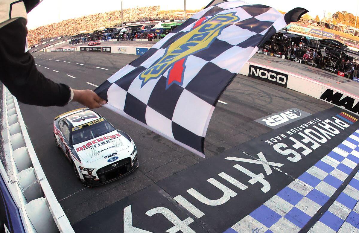 A waving checkered flag at the NASCAR Cup Series Xfinity 500 at Martinsville Speedway in Virginia