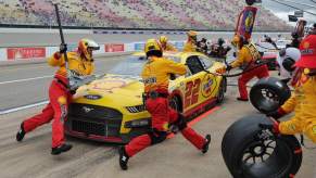 Joey Logano makes a pit stop during the NASCAR Cup Series FireKeepers Casino 400 at Michigan International Speedway on Aug. 7, 2023
