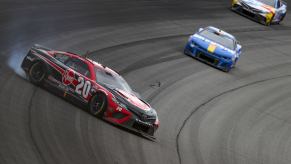 Christopher Bell driving a #20 Toyota Camry model during NASCAR Cup Series FireKeepers Casino 400