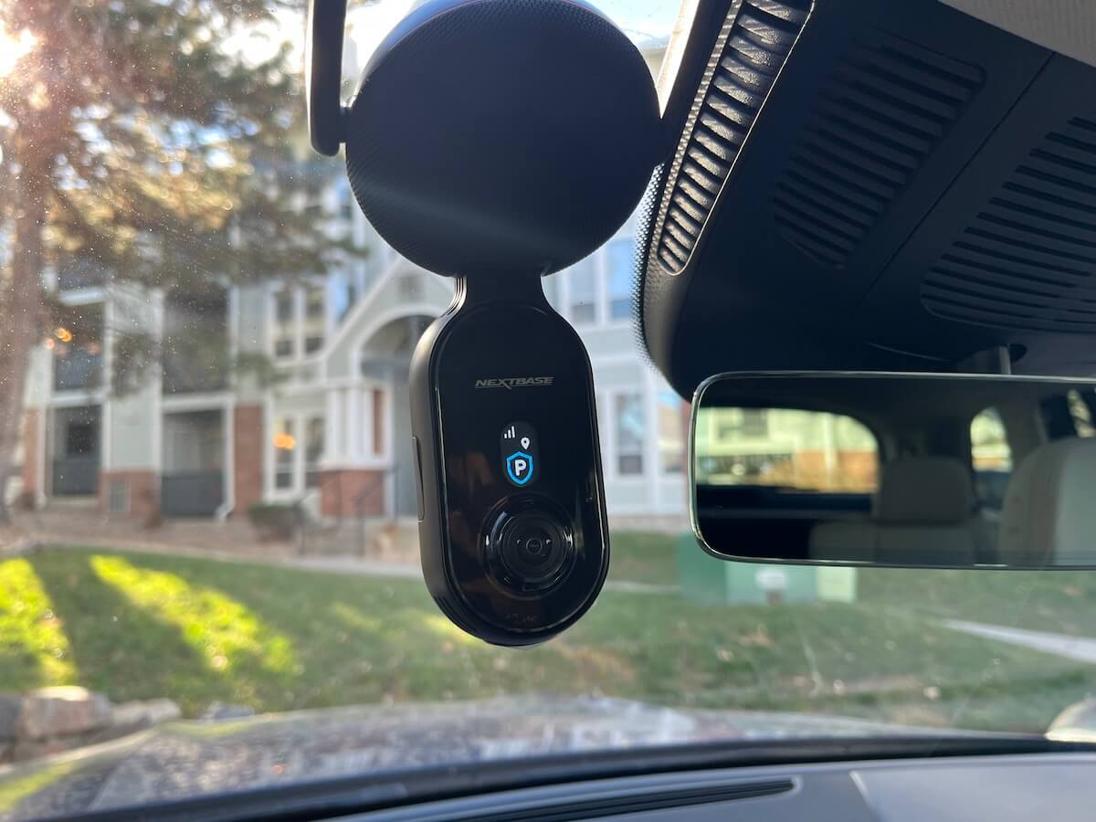 The Nextbase IQ dash cam mounted on a windshield
