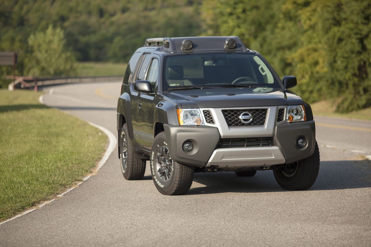 A Nissan Xterra SUV on display on a road.