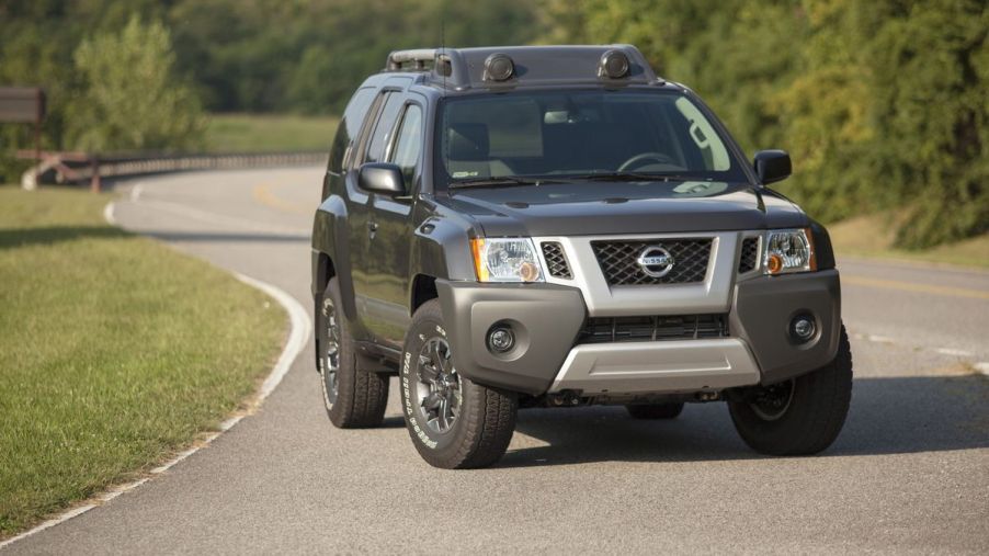 A Nissan Xterra SUV on display on a road.