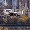 Joby Aviation S5 eVTOL flying car taxi with Manhattan in background