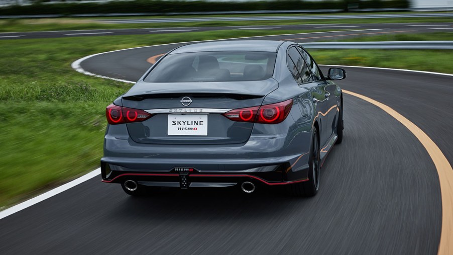 Rear fascia of the 2024 Nissan Skyline Nismo limited edition driving away from the camera on a windy road