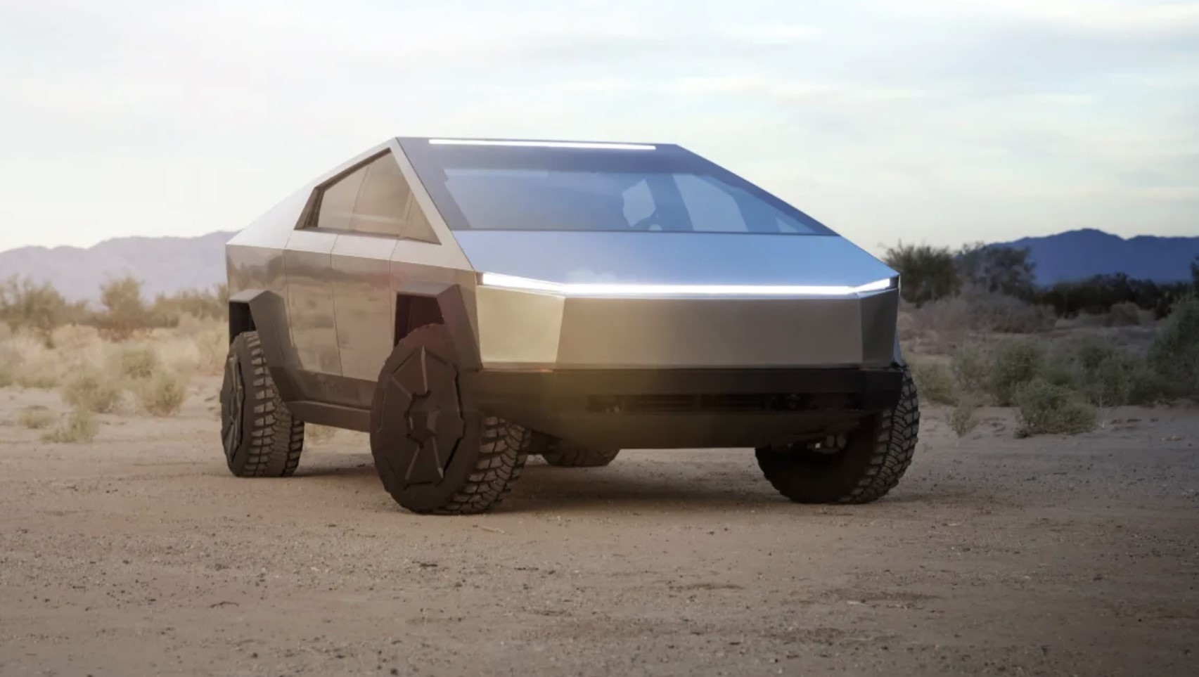 The Tesla Cybertruck parked in the sand