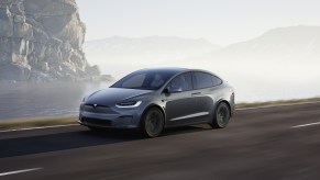 A gray Tesla Model X driving near a cliff. Tesla advertising might start for the Model X.