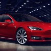 2023 Tesla Model S in dark auditorium