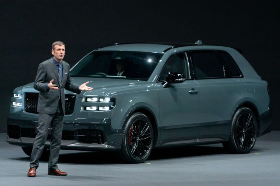 A Toyota Century on display during an auto show presentation.