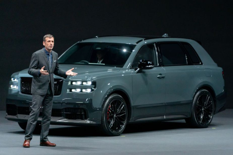 A Toyota Century on display during an auto show presentation.