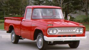 A red Toyota Stout pickup truck on display.