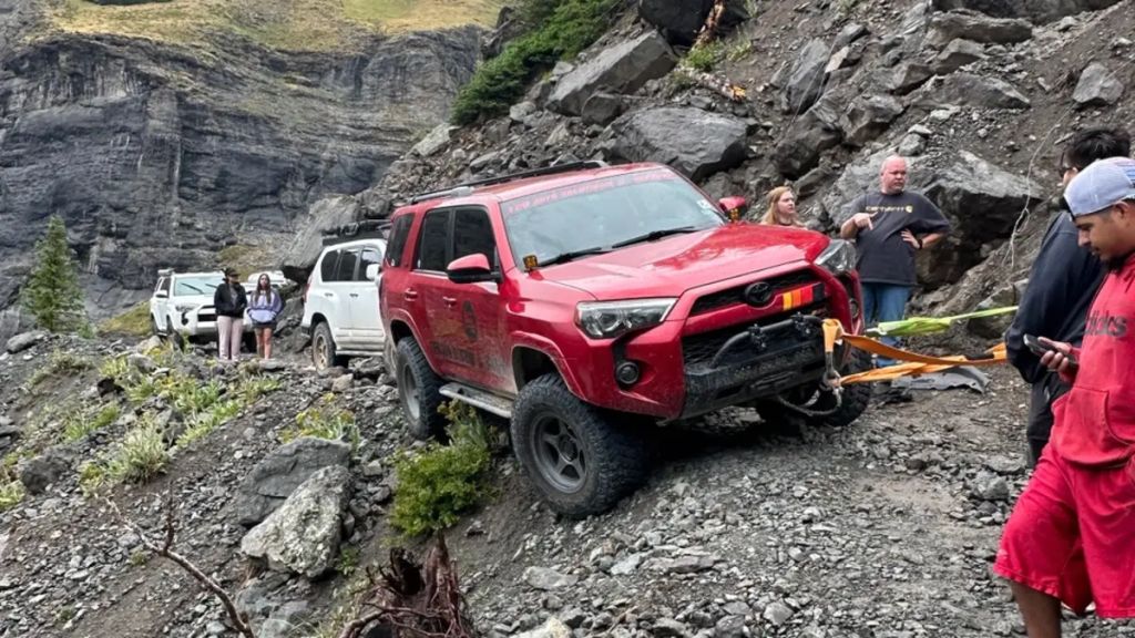Toyota 4Runner clinging to a Rocky Mountain trail 