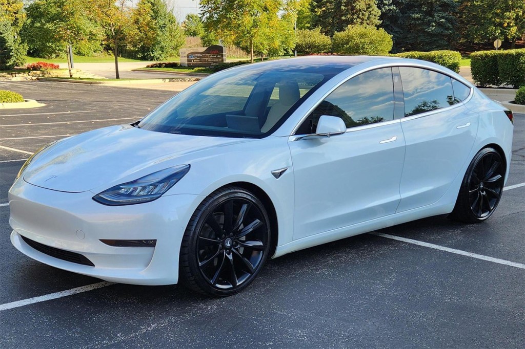 White used Tesla Model 3 Performance sold on Cars and Bids for only $25,000
