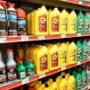 A Family Dollar Store aisle filled with automotive fluid products such as dielectric grease
