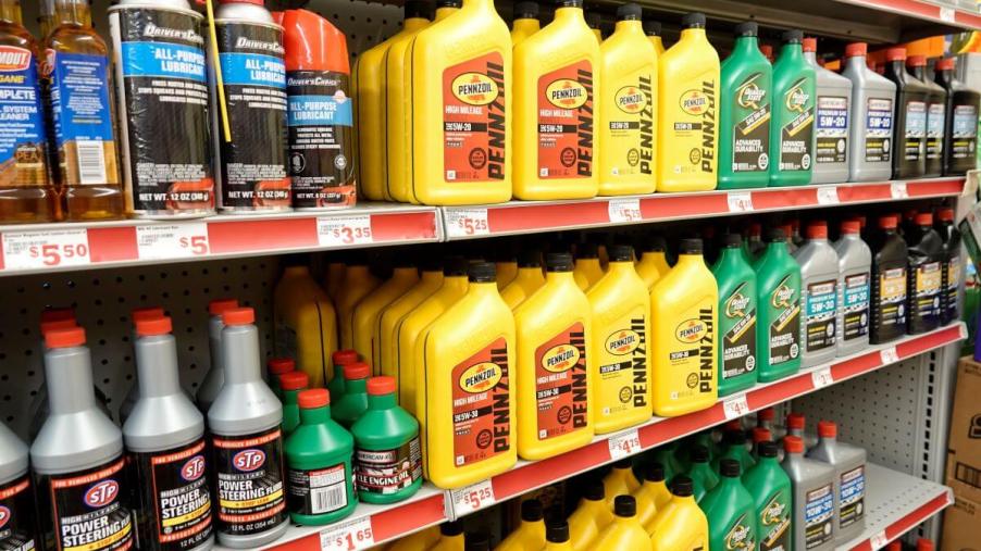 A Family Dollar Store aisle filled with automotive fluid products such as dielectric grease