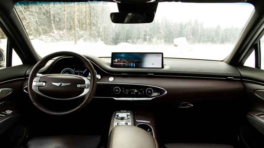 A car infotainment is shown in a vehicle driving in winter weather