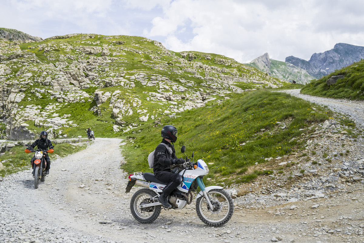 People riding dirt bikes on access roads
