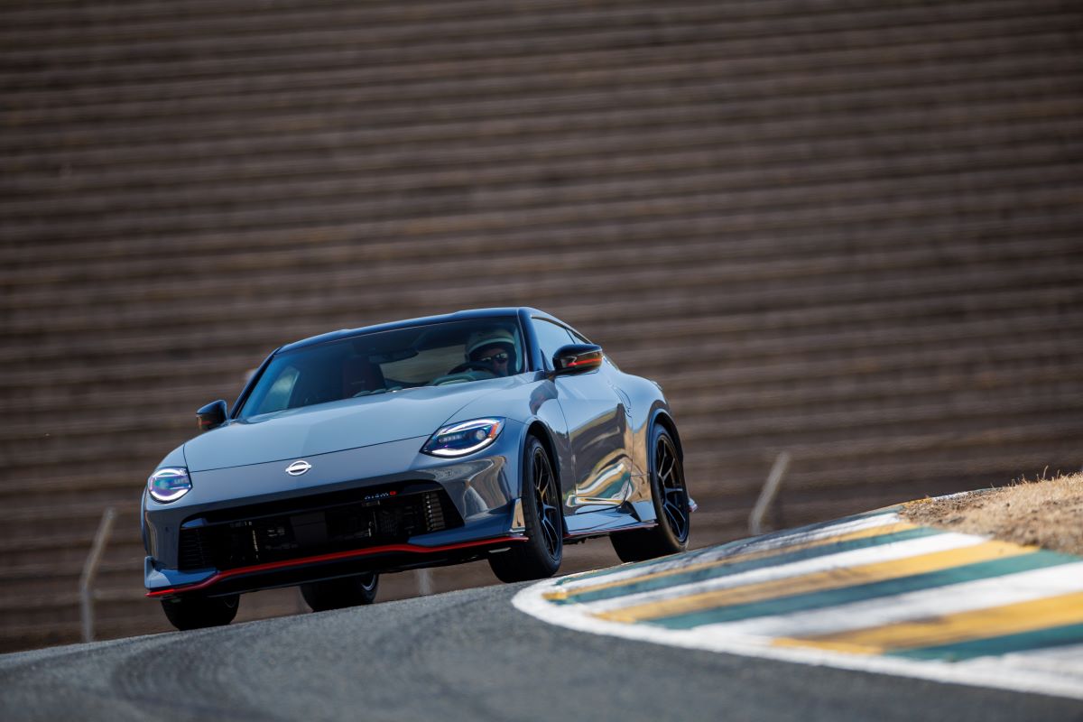 A 2024 Nissan Z NISMO sports car coupe model cornering on a race track course