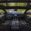 The interior front seating, windows, sunroof, dashboard, and seat belts of the 2023 Jeep Wagoneer full-size SUV