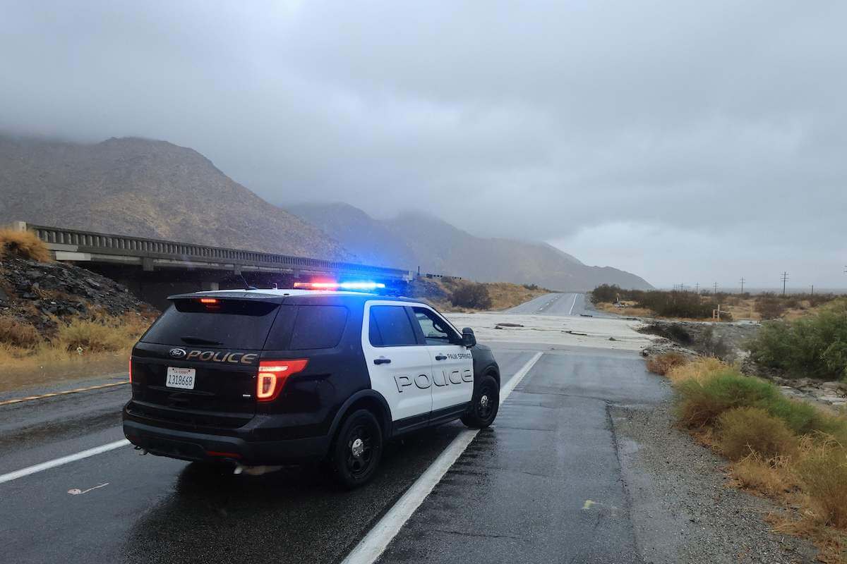 A rear view of a police SUV pulled over on the road