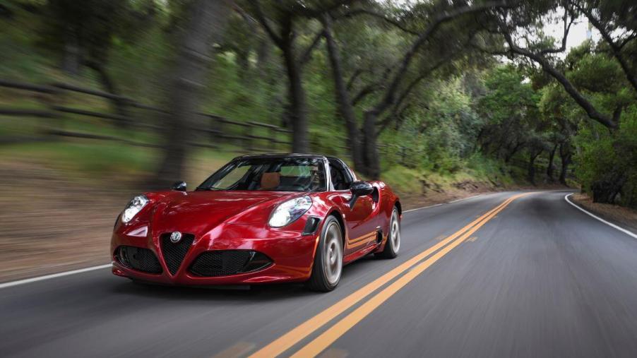 A 2020 Alfa Romeo 4C Spider 33 Stradale sports car coupe roadster model on a forest highway
