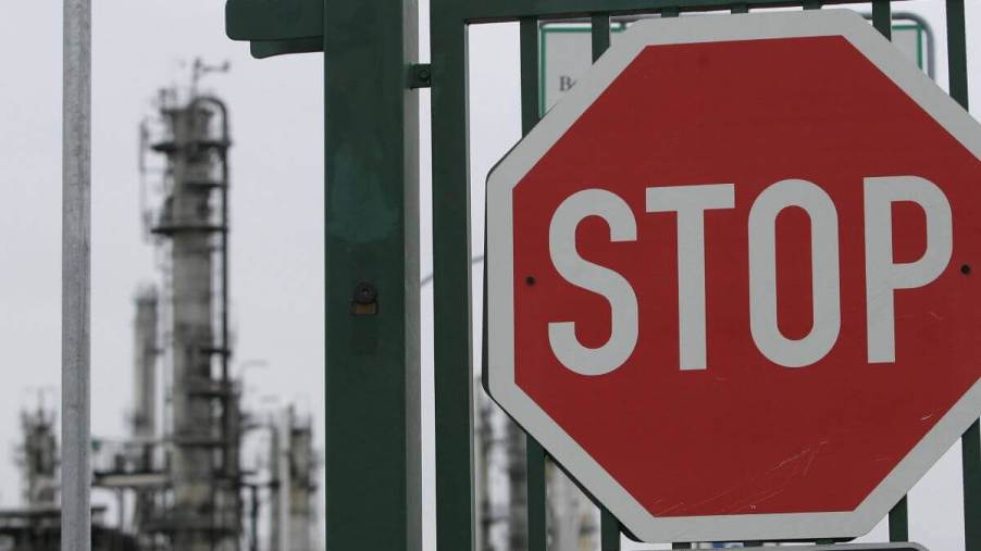A stop sign fixed on the entrance gate to a PCK crude oil refinery in Schwedt, Germany