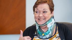Ruth Bobeczko of Hunting Beach wearing a neck brace after fractured neck spine procedure