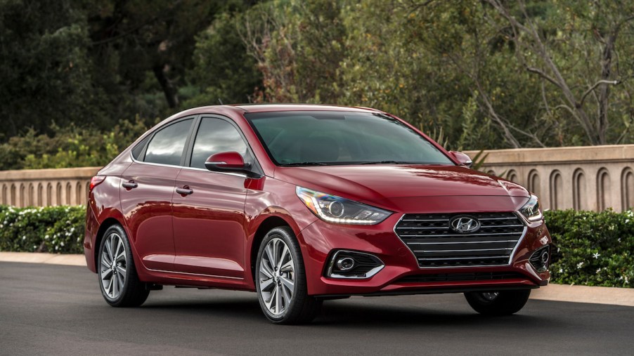 A red Hyundai Accent, which is one of the most reliable Hyundai models.
