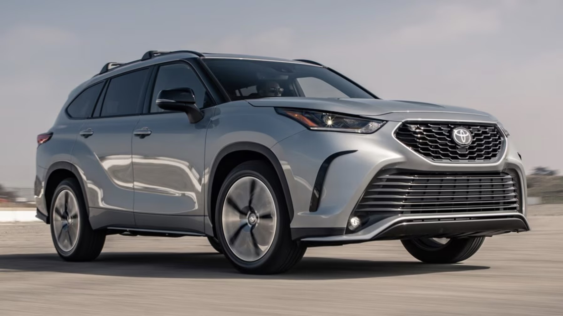 The 2022 Toyota Highlander parked on pavement 