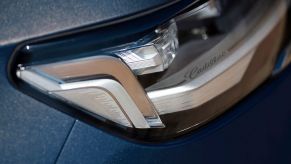 A 2023 Cadillac Escalade ESV shows off the details of its headlights.