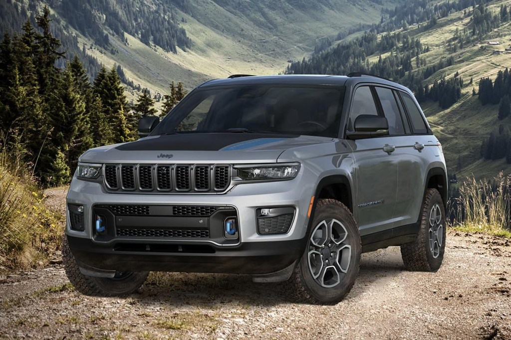 The 2023 Jeep Grand Cherokee 4xe off-roading in the woods