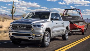 The 2023 Ram 1500 towing a boat