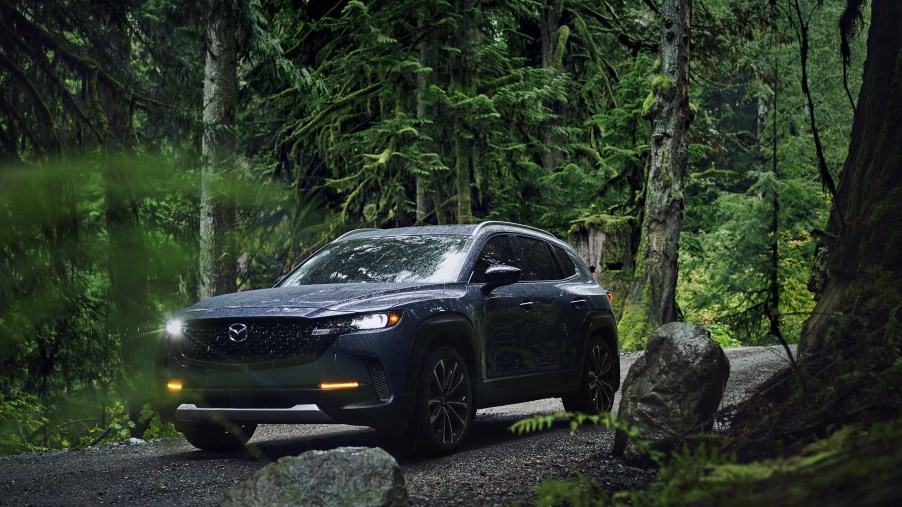 The 2024 Mazda CX-50 off-roading in the woods