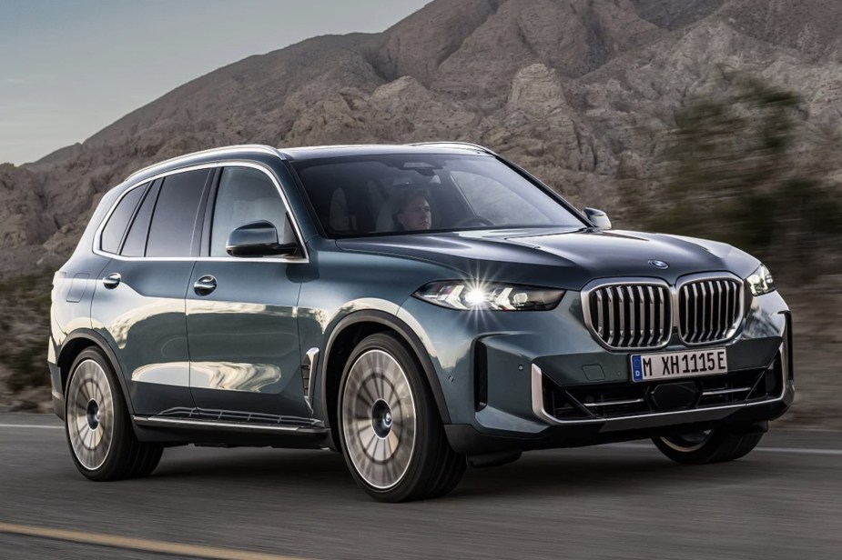 The 2024 BMW X5 driving on the road