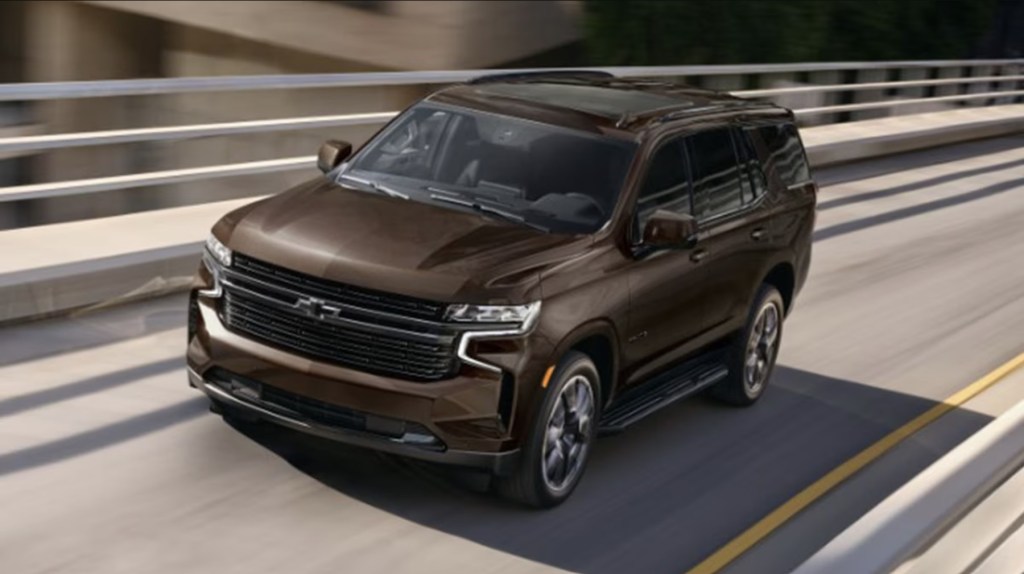 The 2024 Chevy Tahoe driving down the road