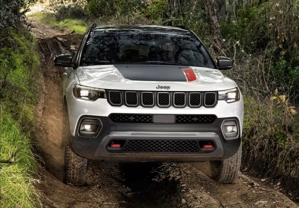 The front end of the 2024 Jeep Compass Trailhawk in the woods