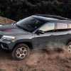The 2024 Jeep Compass Trailhawk off-roading in the dirt